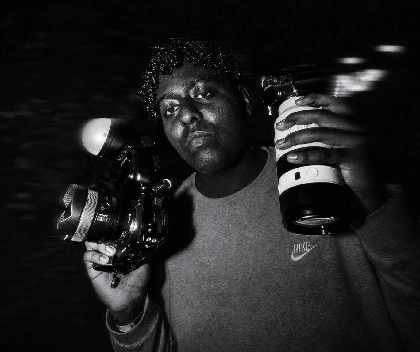 Michias Tegegne with camera and lens on a film production